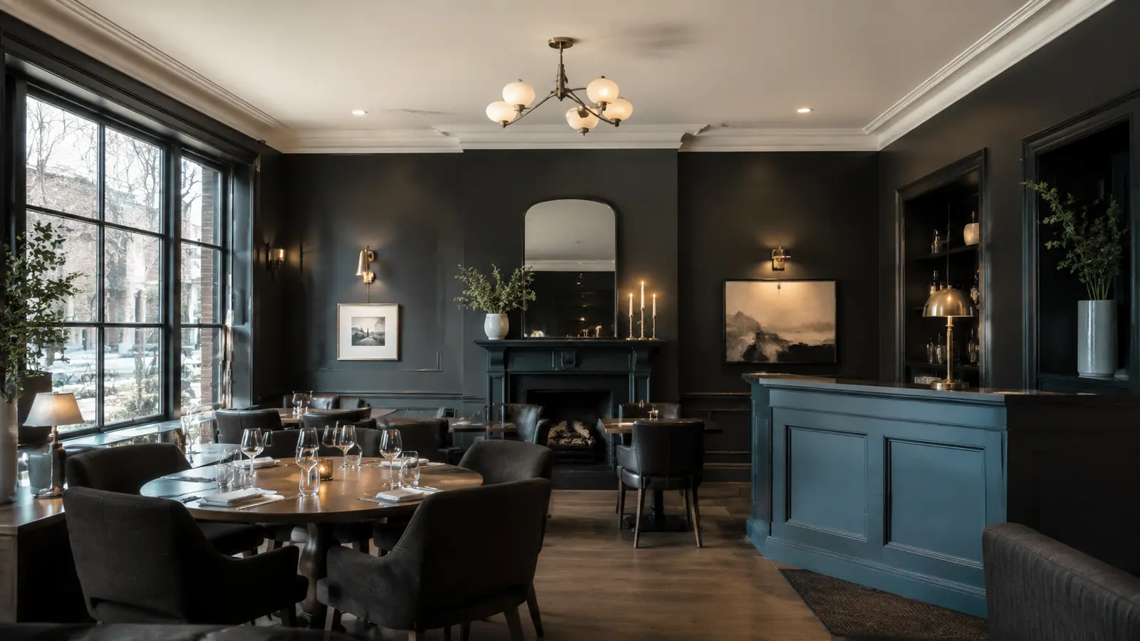 Finished restaurant interior with charcoal walls, bright trim, and a muted blue service counter.