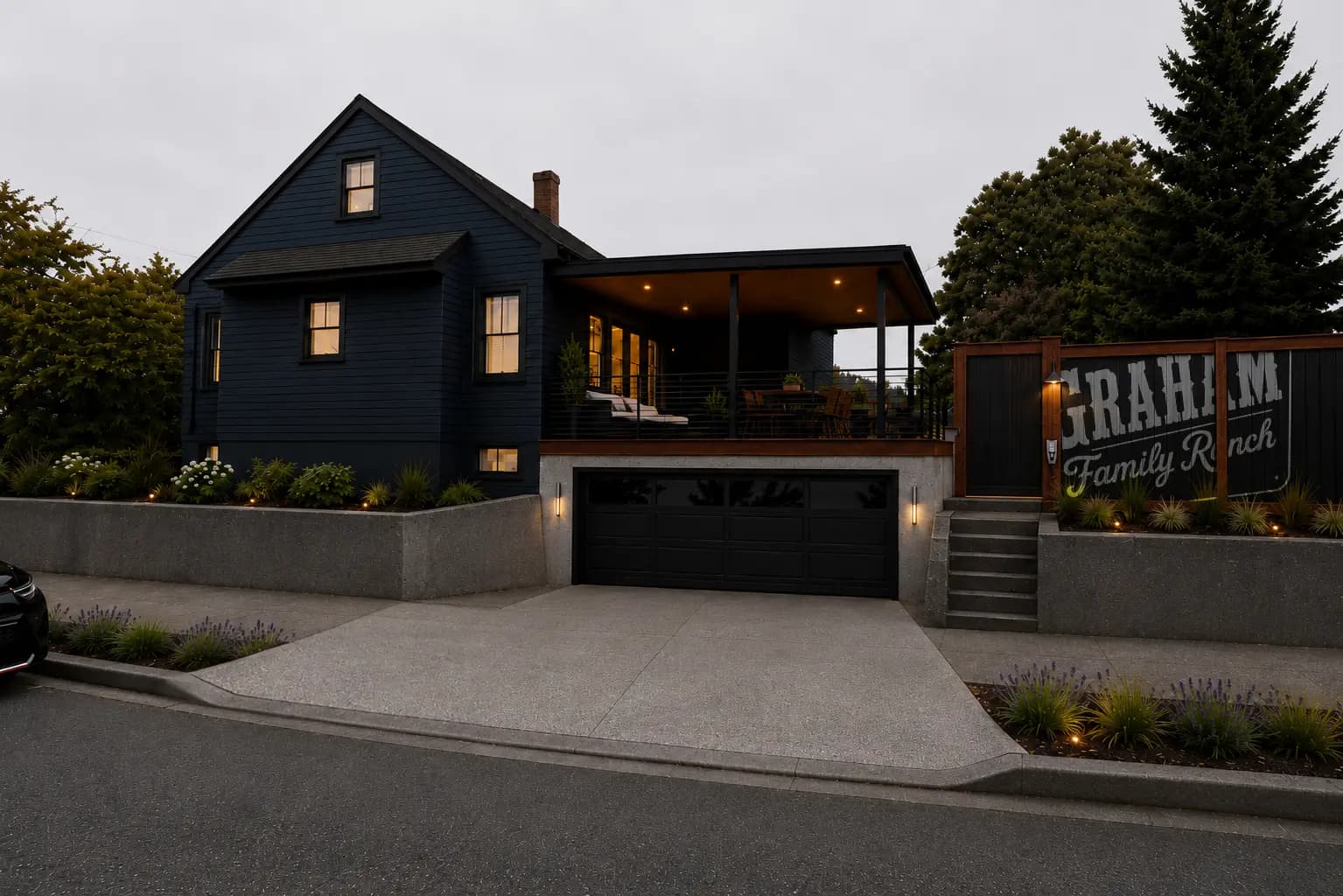 The completed home, garage, patio, driveway, and landscape viewed from the street.