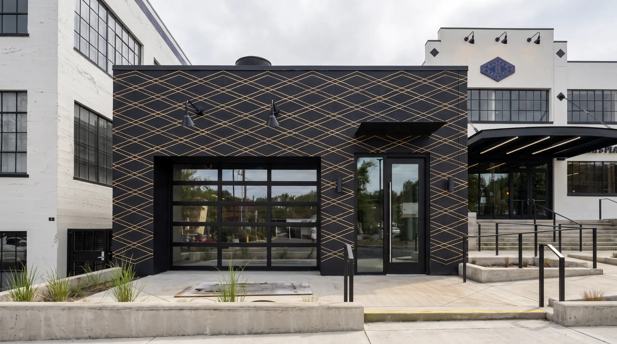 The Water Tower commercial exterior with a black-and-gold geometric facade.